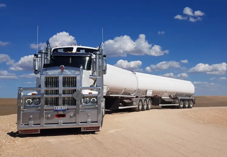 A white liquid carrier truck