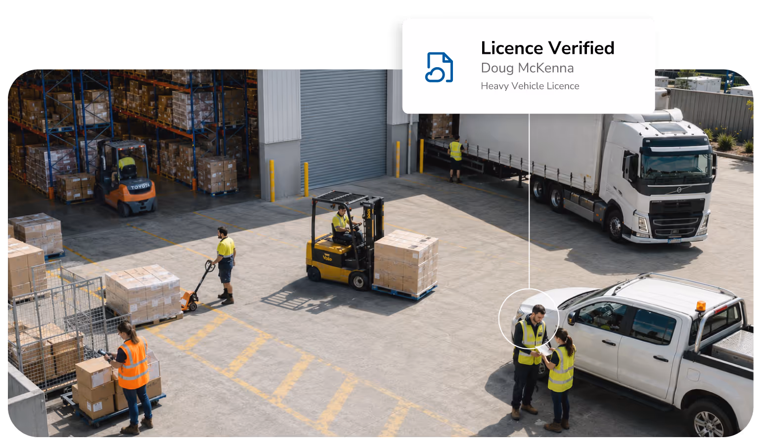 A busy loading area at a warehouse where people are working using pallett jacks and forklifts.