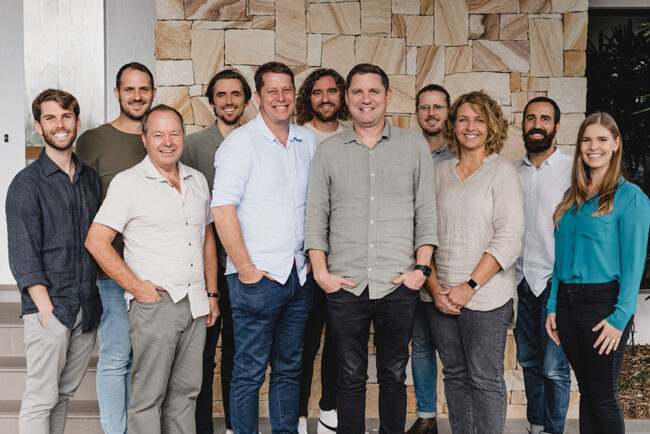 a group of people standing smiling